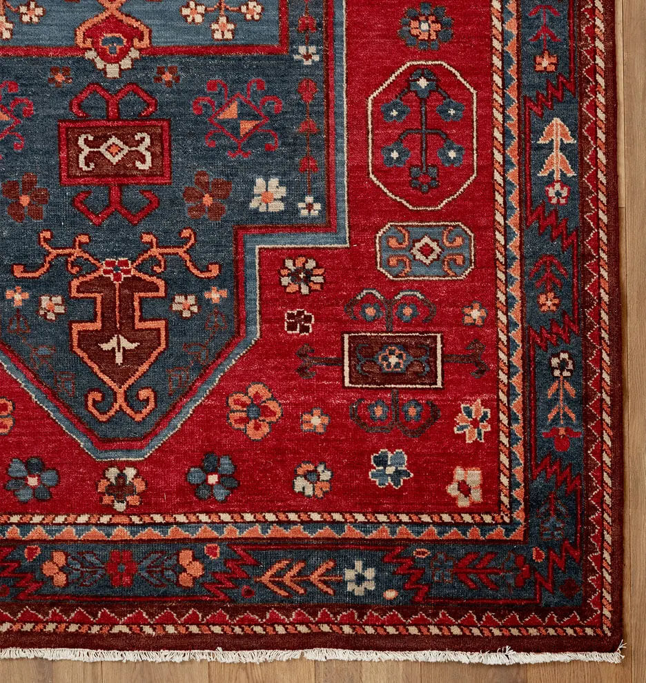 Closeup of Area rug on wood floor.